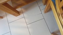 One of the cracked floor tiles