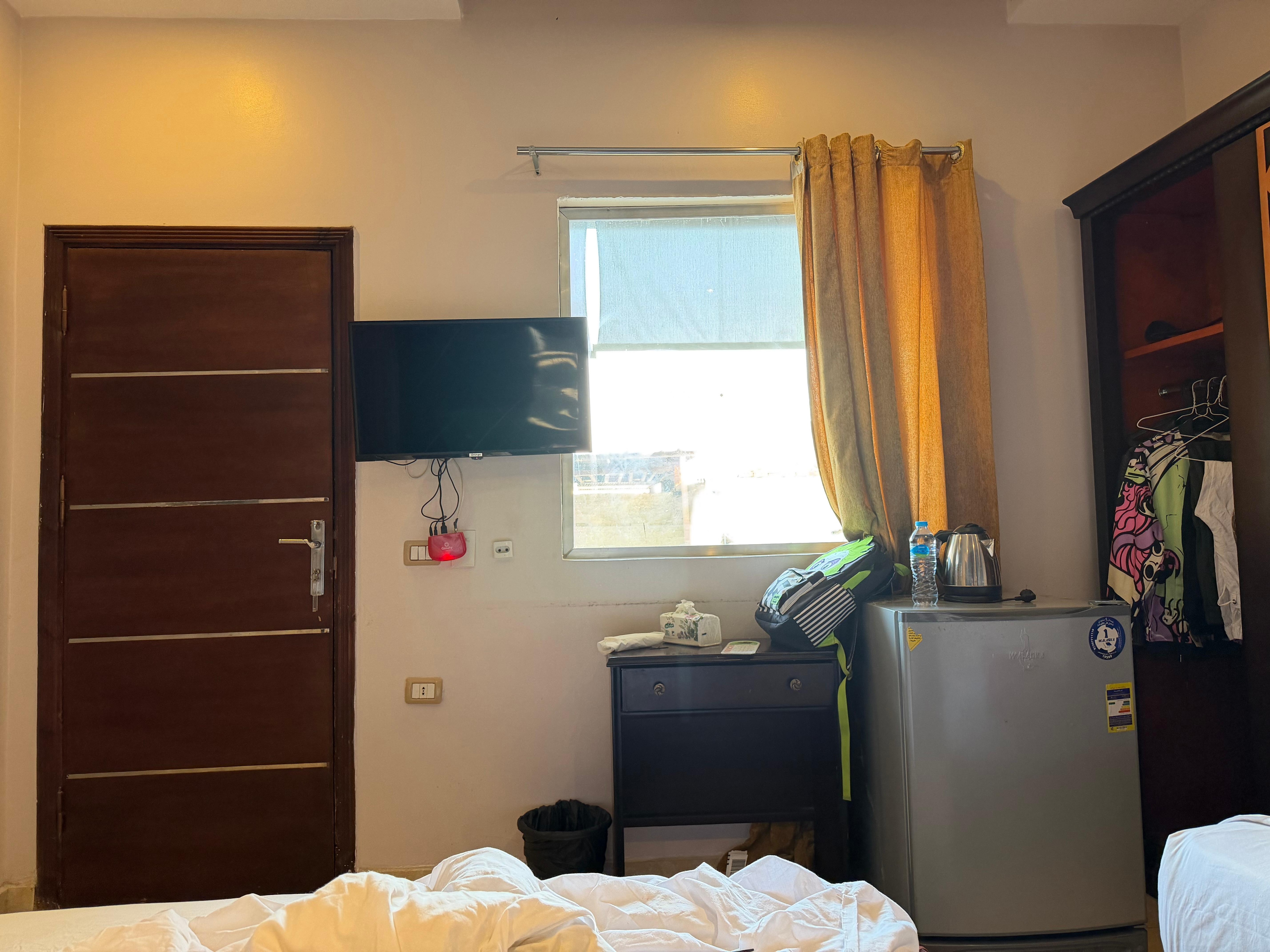 The actual view. Even if the windows were clean it would have been impossible to see the pyramid unless your stood at the window
And even then the view is through a corridor, another window and a whole bunch of rooftops