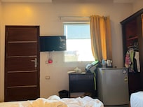 The actual view. Even if the windows were clean it would have been impossible to see the pyramid unless your stood at the window
And even then the view is through a corridor, another window and a whole bunch of rooftops