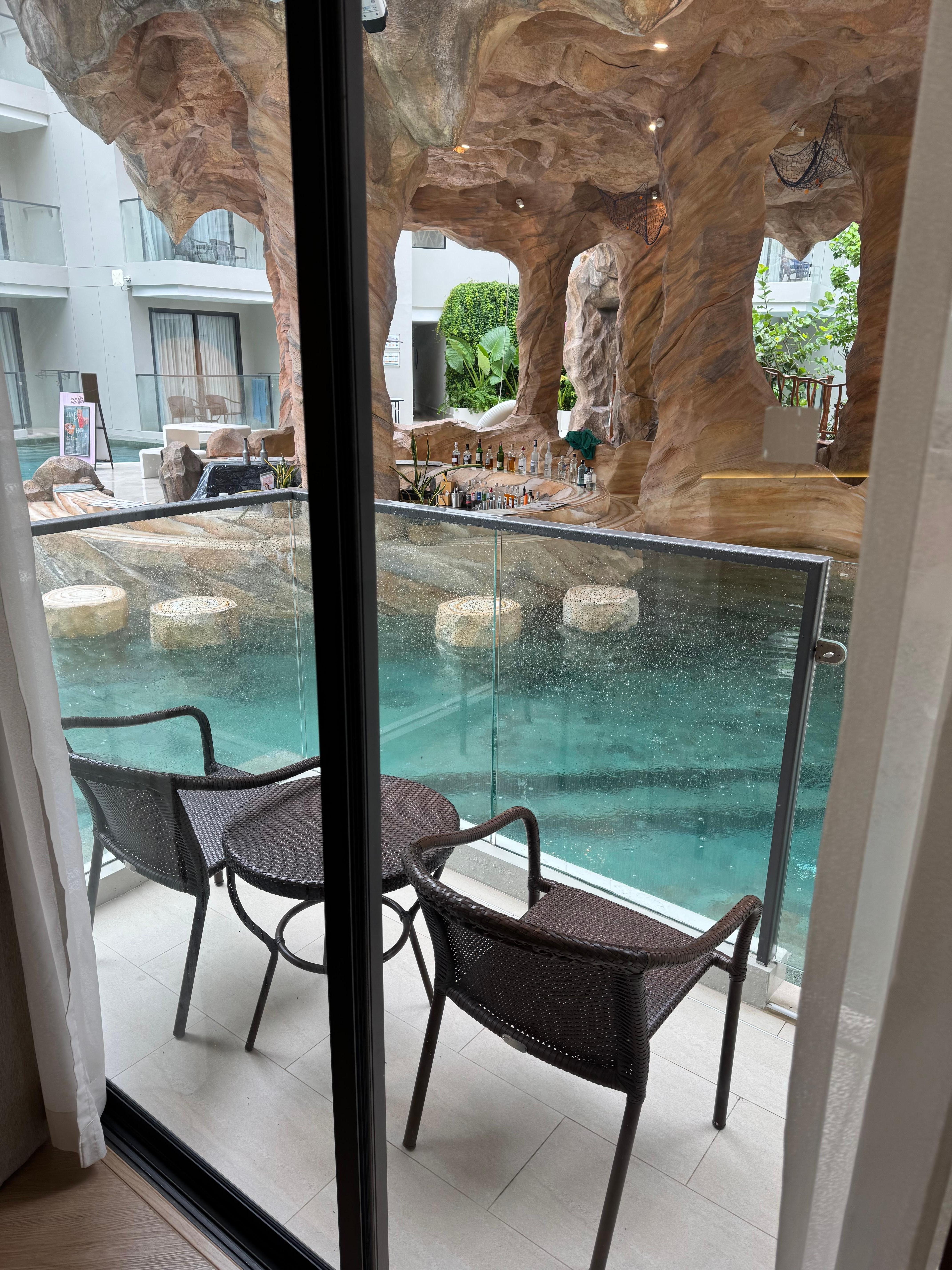 Our balcony opening into the loud pool bar