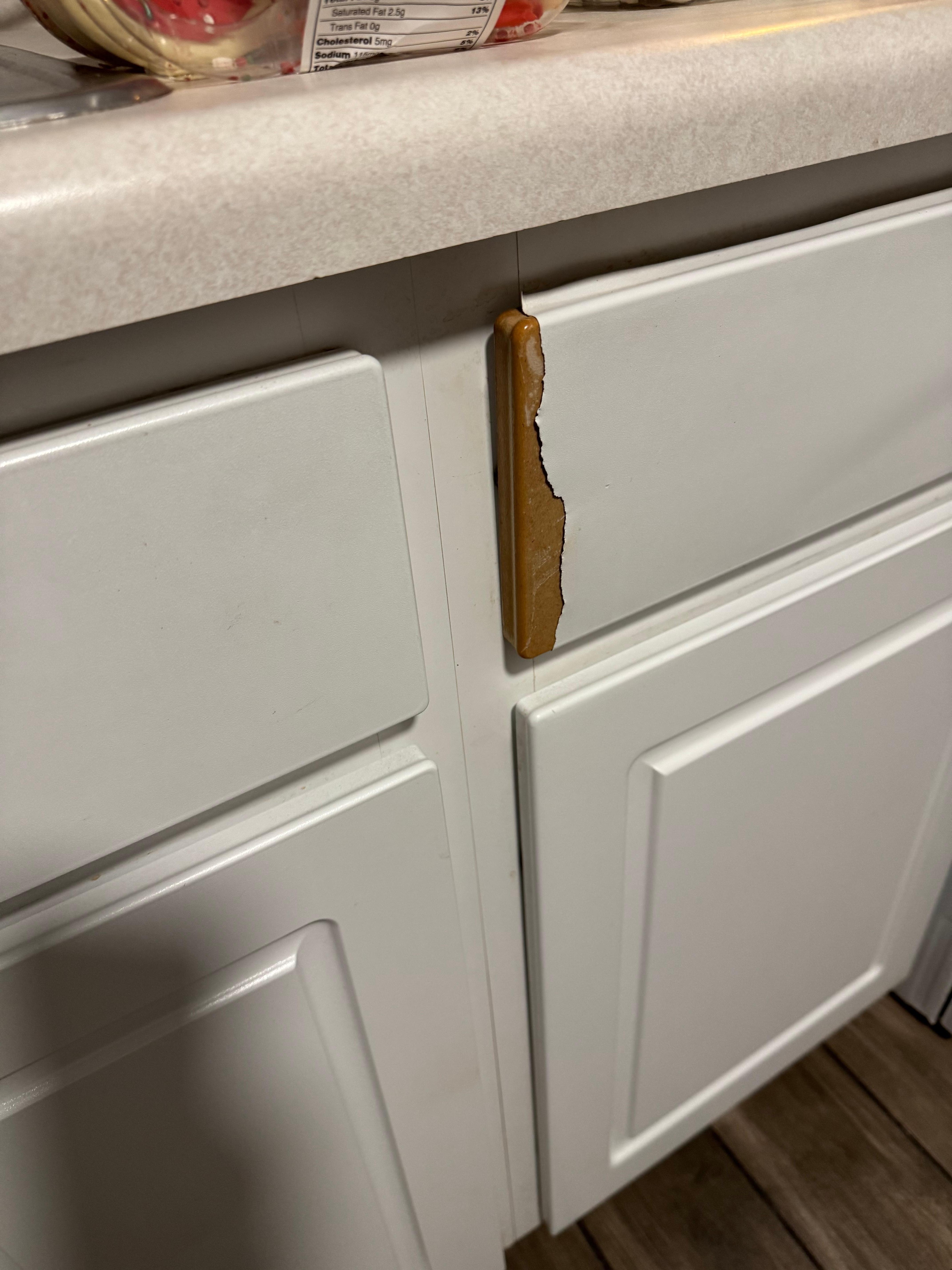 The cabinet trim was just peeling away.
