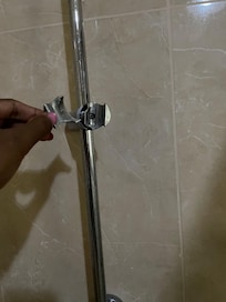 Broken shower fixer leading to excess water all over the floor