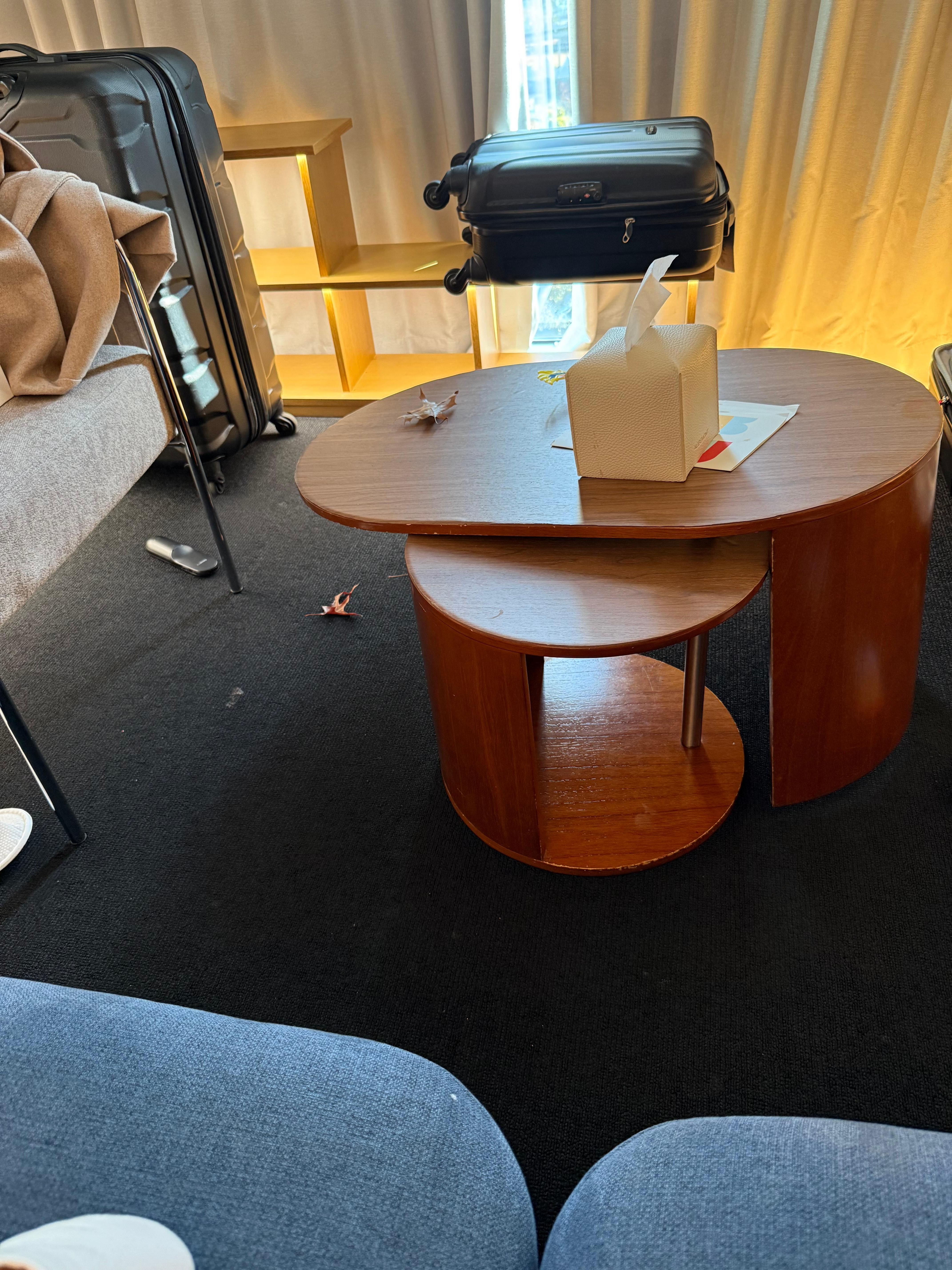 Faulty and dangerous coffee table. It would topple over with just a light lean. 