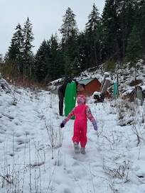 Sledding on the hill steps from the cabin