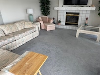 Just a wider shot of the living room not completed and debris all over the floors.
