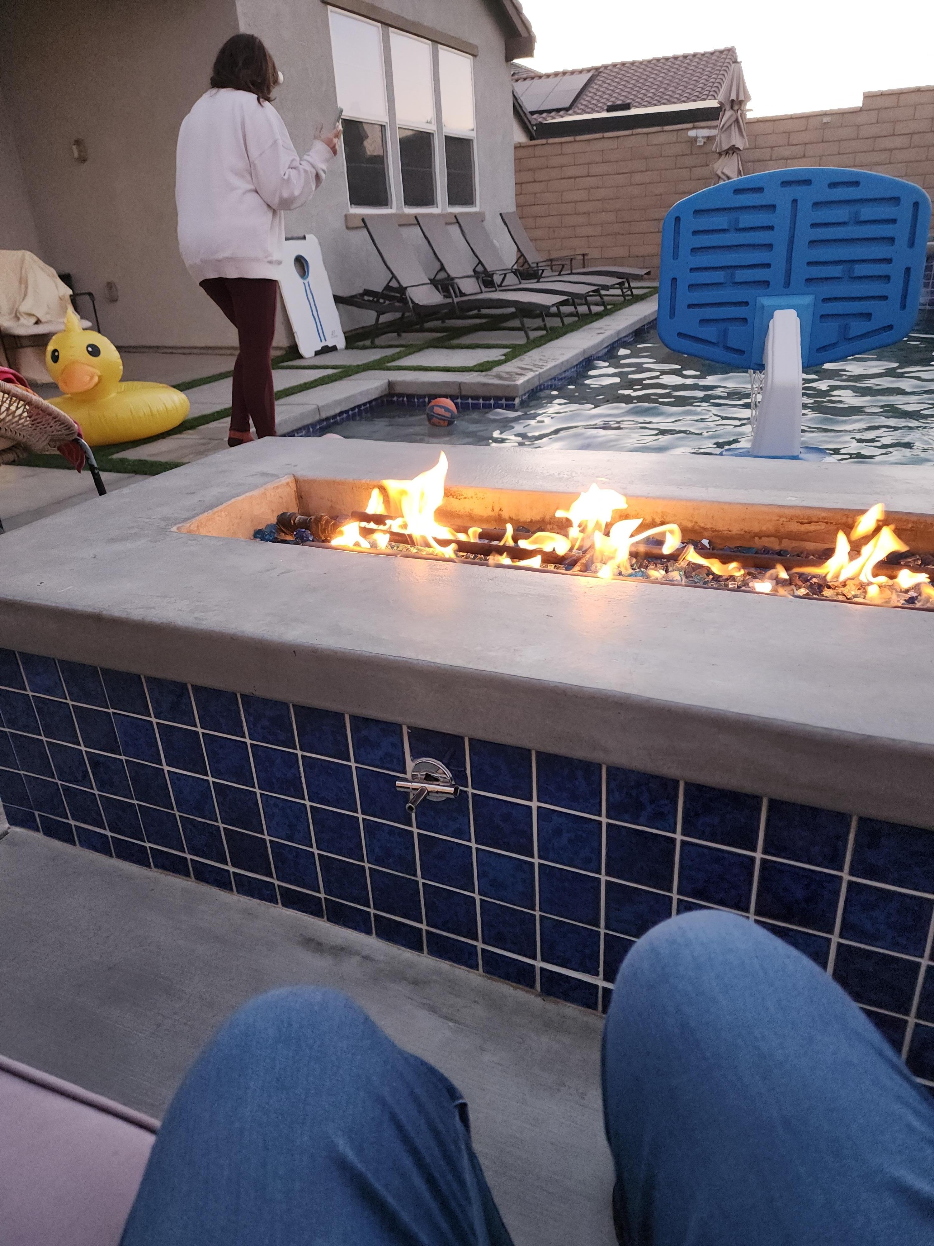 Warming at the fireplace.
