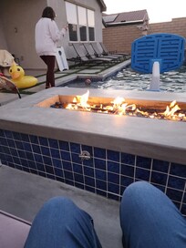 Warming at the fireplace.