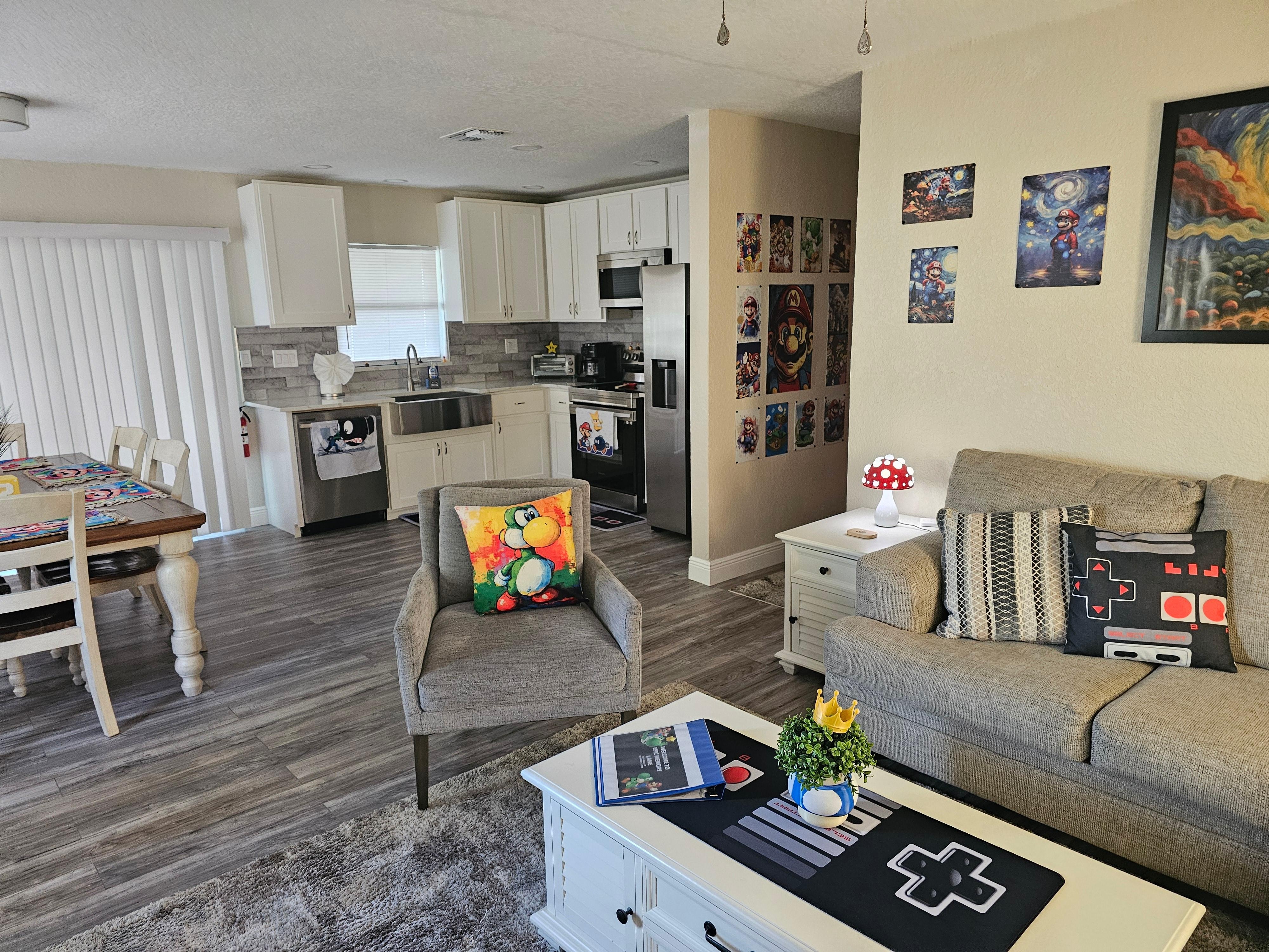 The great room with full kitchen, living room, entertainment center.