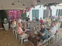 Family sitting down for evening meal