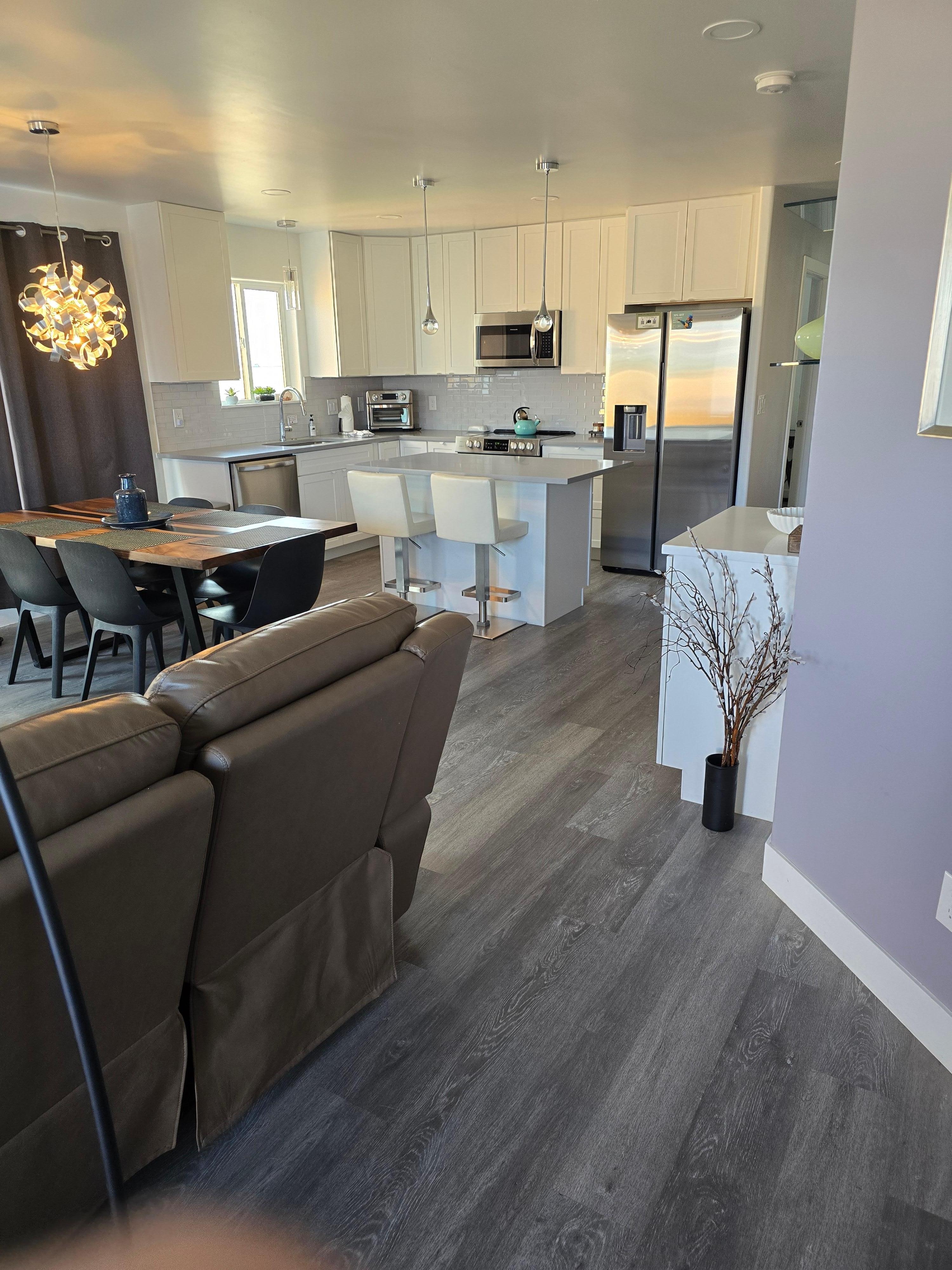 The kitchen, dining area and part of the reclining on either end couch. Comfortable!