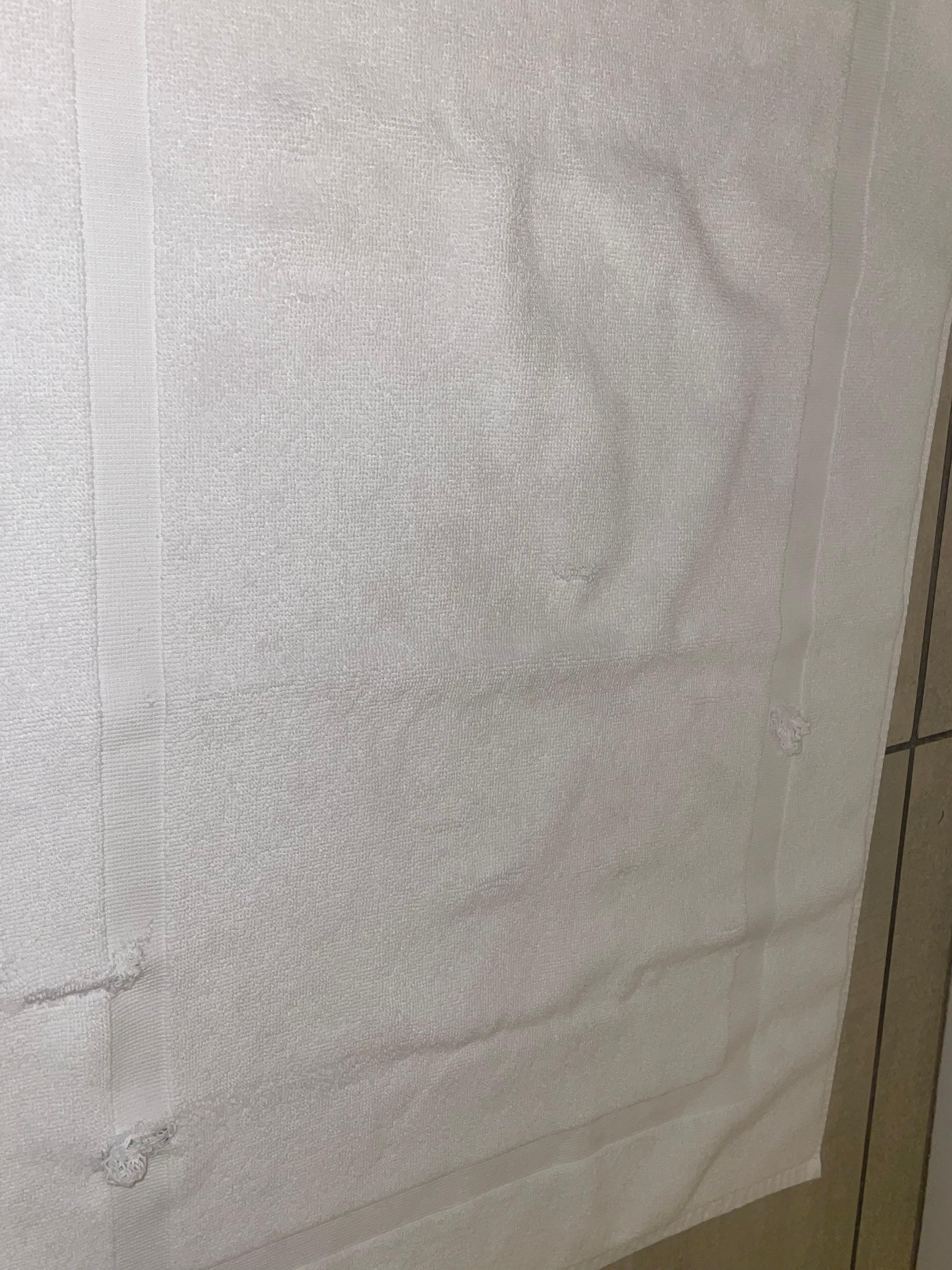 Dirty and ripped bath mat