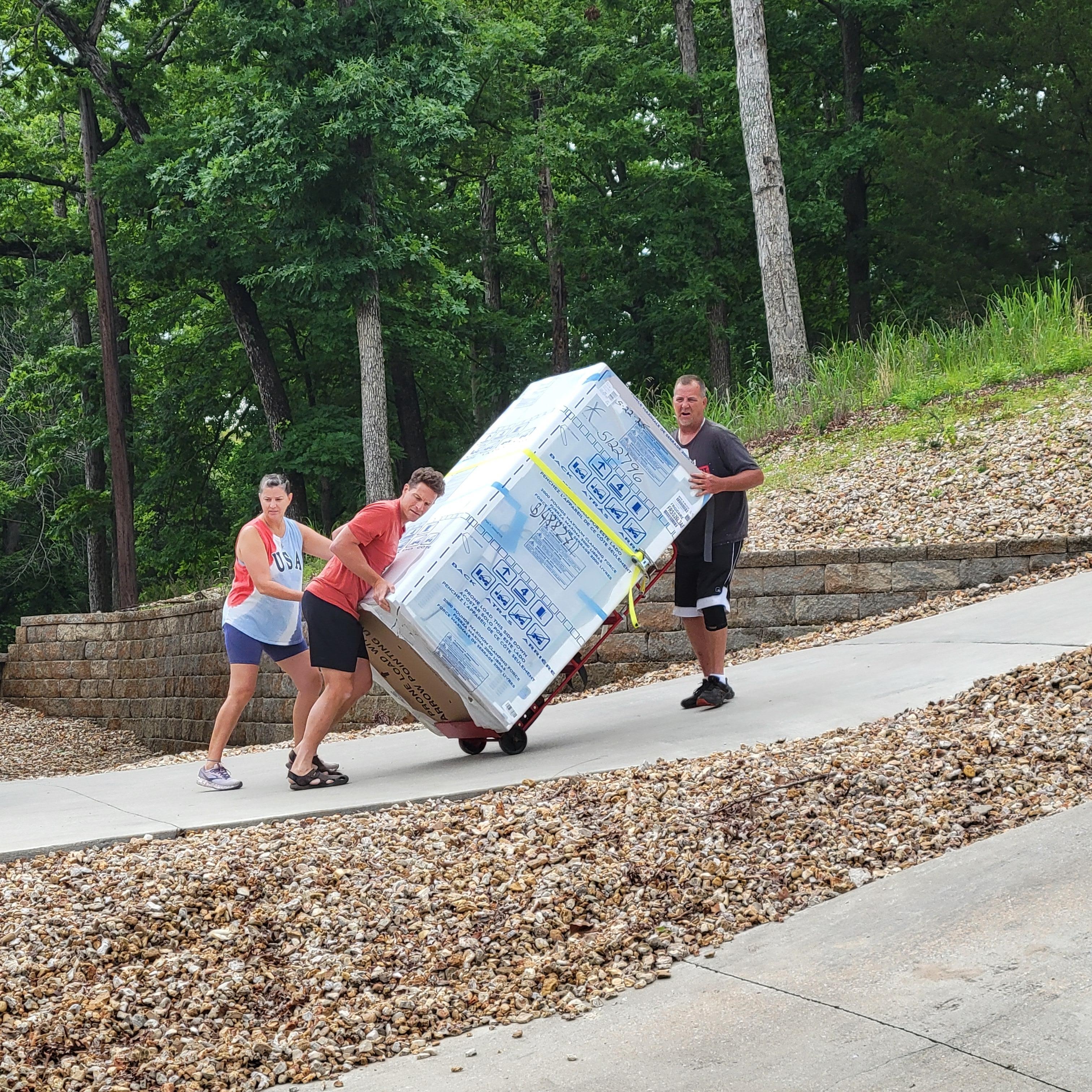 Kids helping Caretaker with the new refrigerator