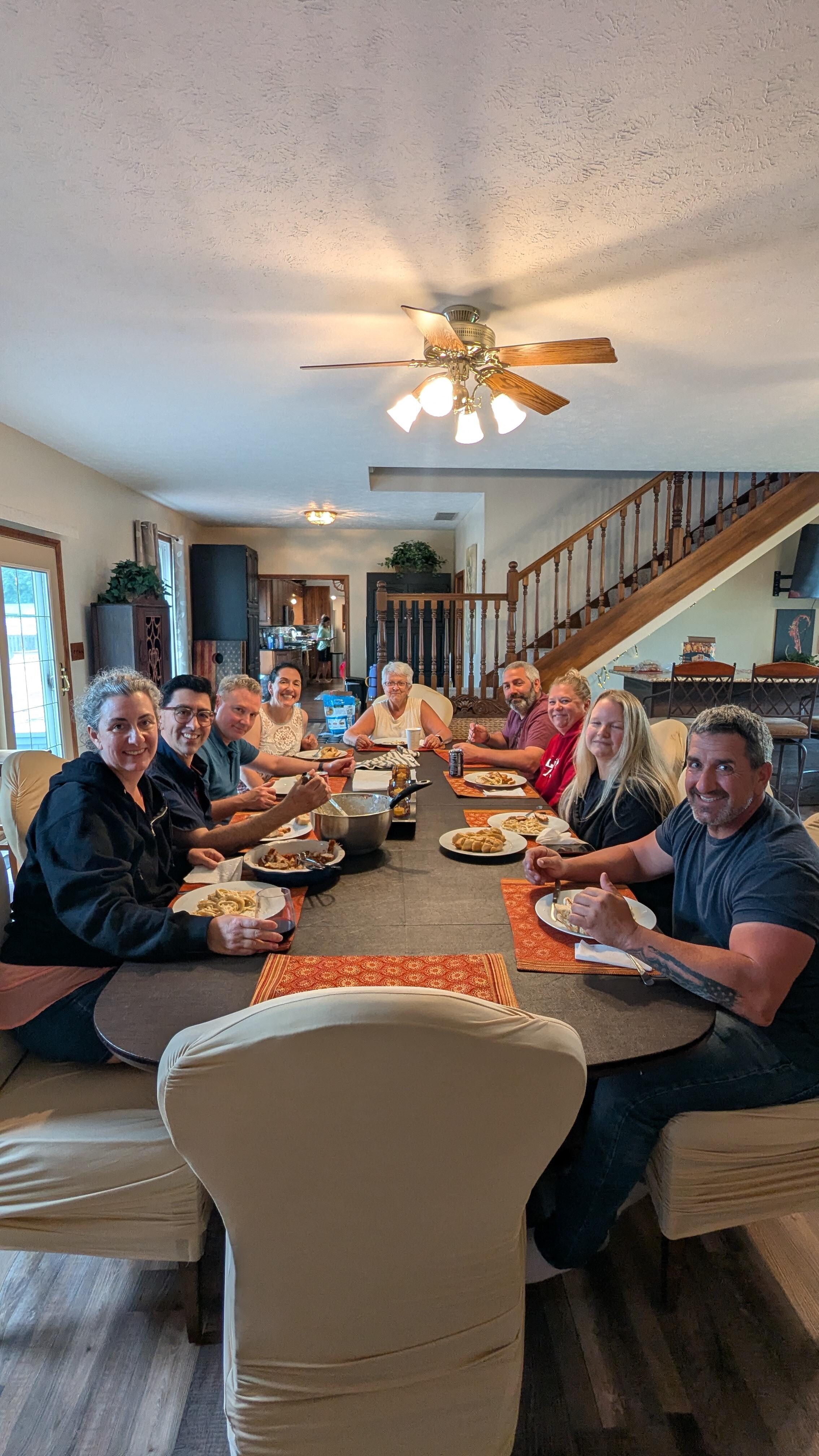 Adults enjoying dinner at the big dinning table