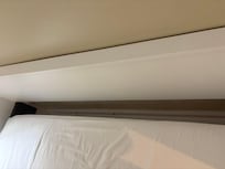 Significant gap between mattress and headboard.