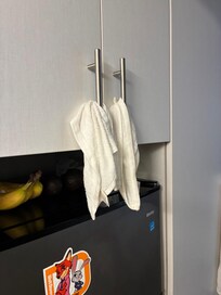 Every cabinet has towels hanging because no clean provided