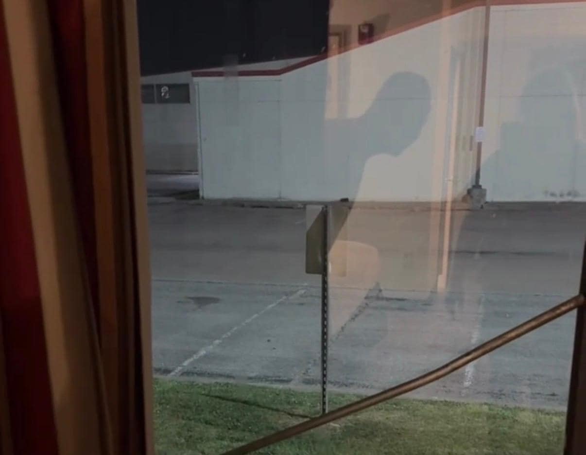 Metal rod holding window closed 