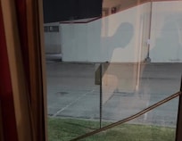 Metal rod holding window closed