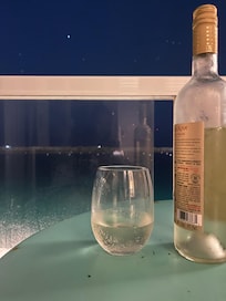 Evening views, sea lions, in the distance, and some white wine.