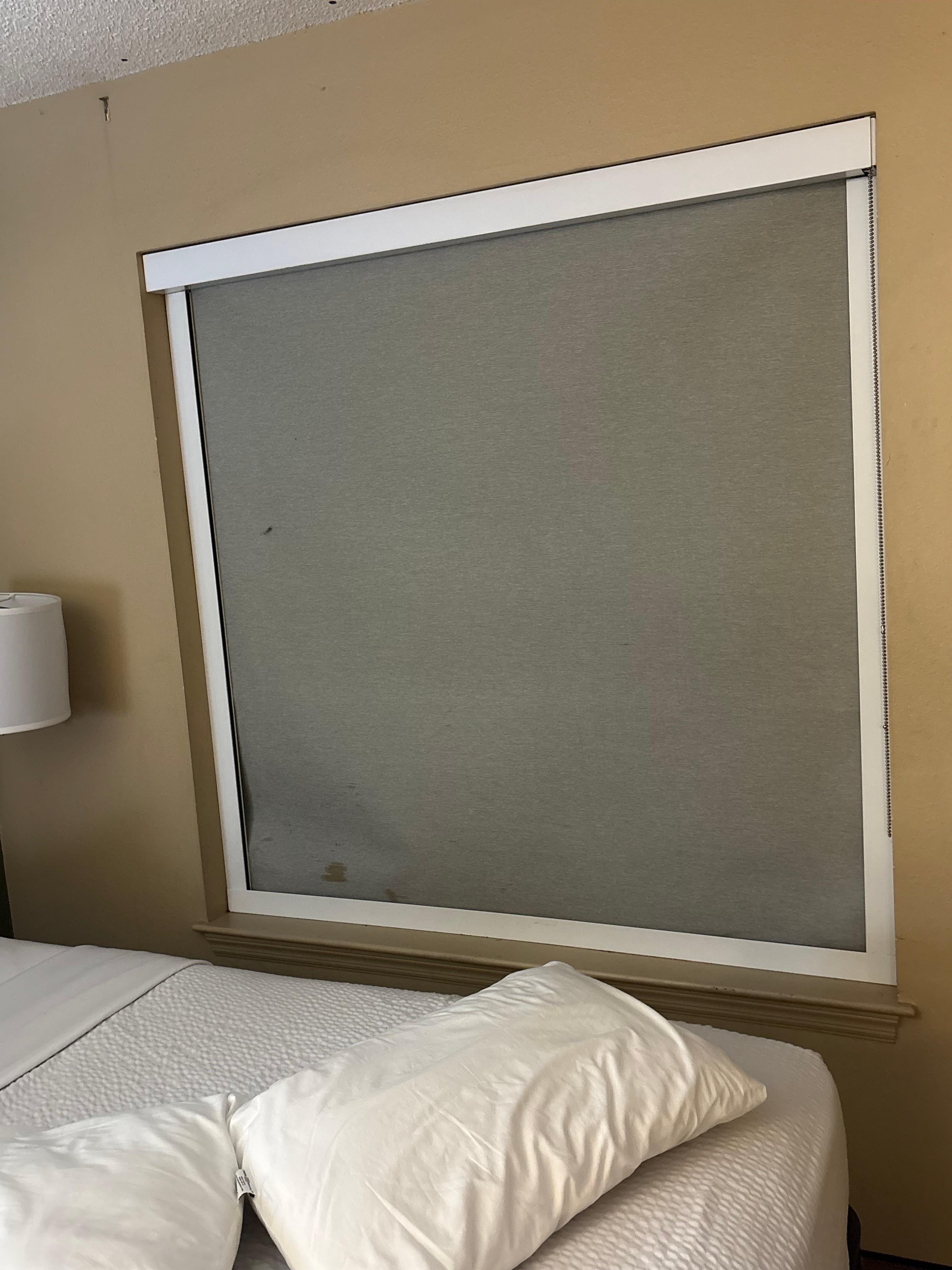 Stains on the blinds with something on the wall