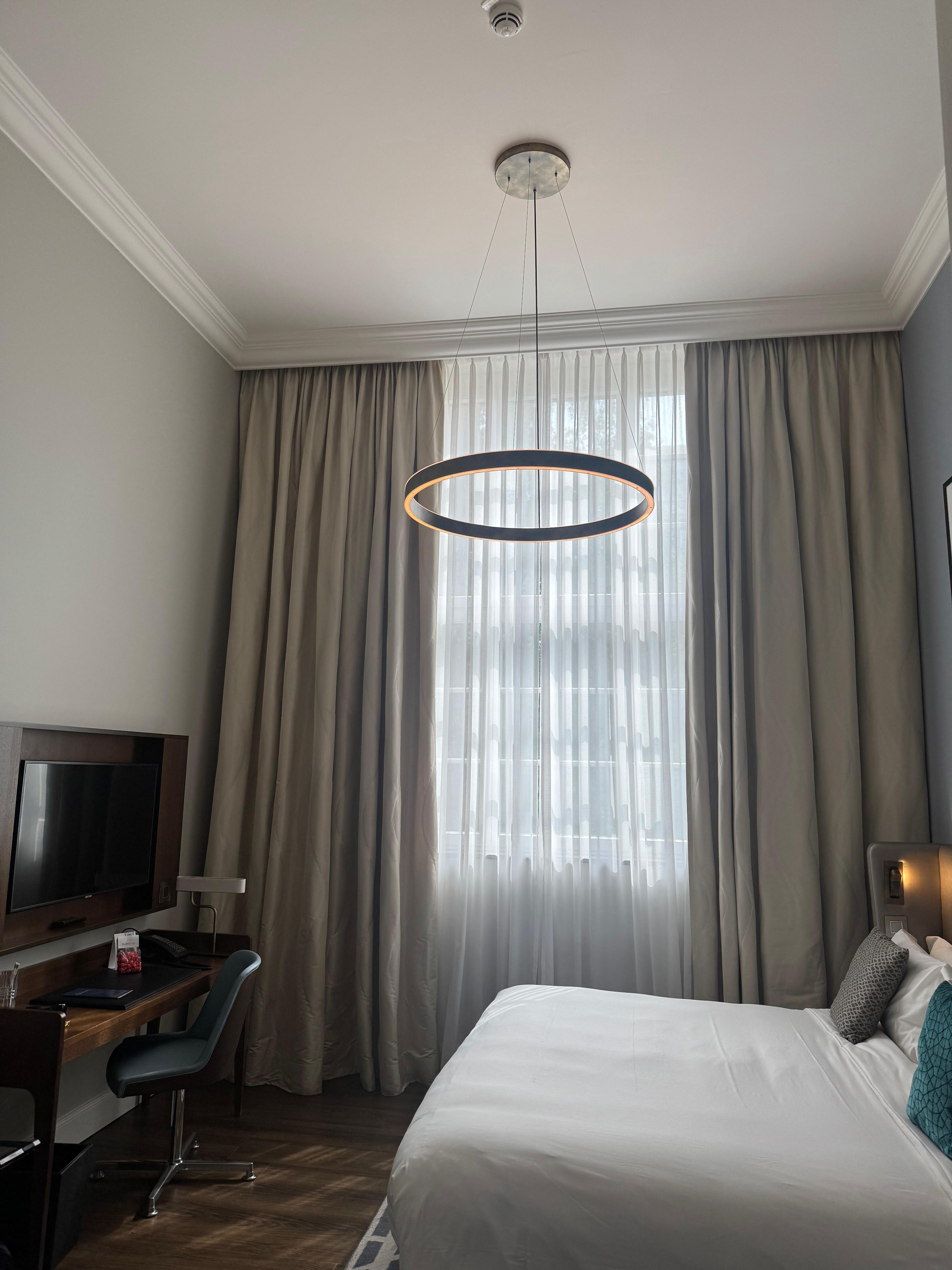 Spacious with a high ceiling. Bathroom as well as a closet about the size of a full walk in closet are behind.