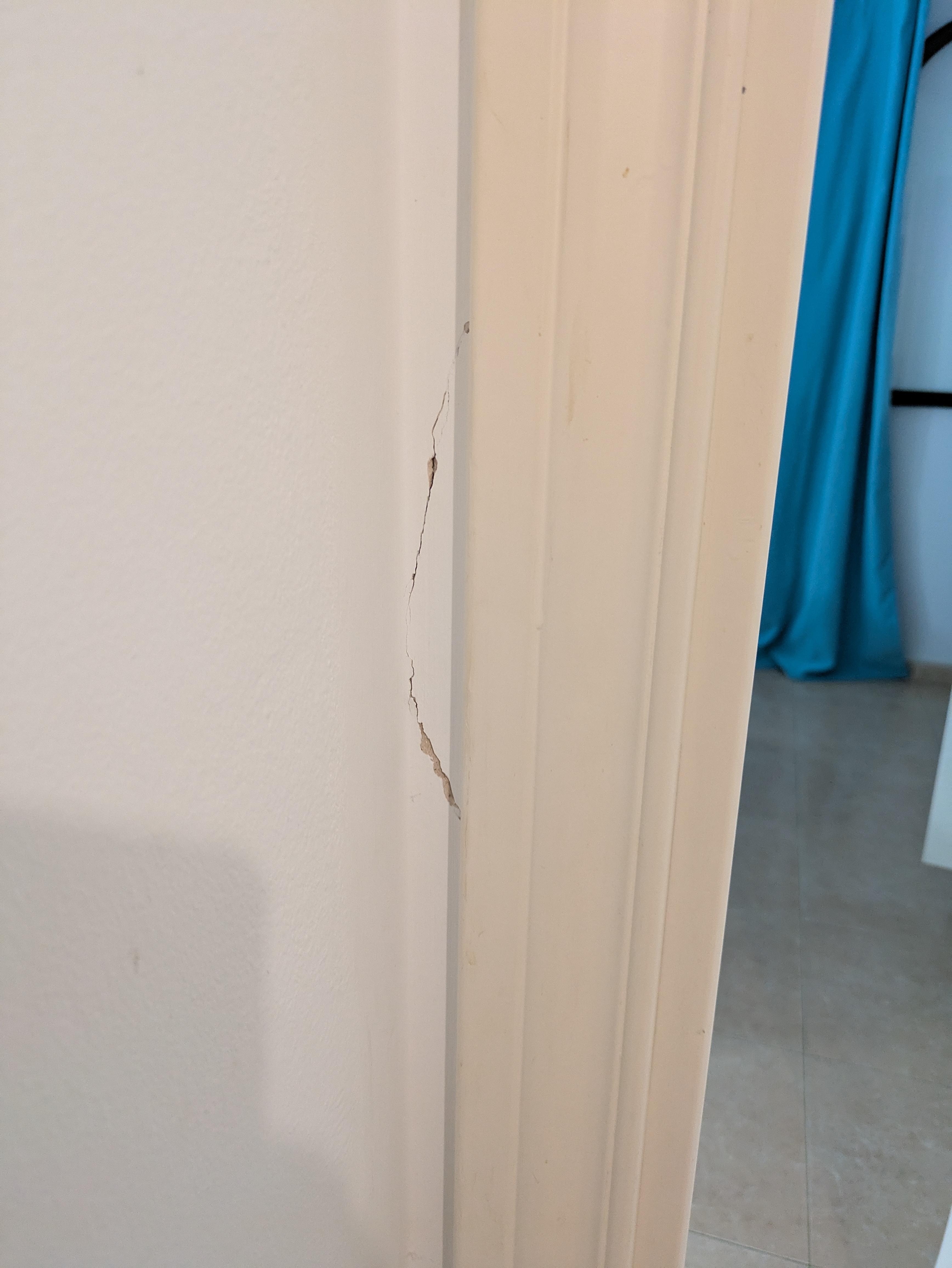 crack on wall by door