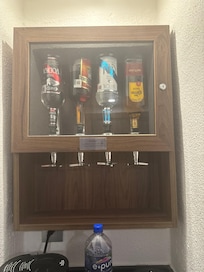 Mini bar in rooms and a completely stacked mini fridge with water and beverages cold beer