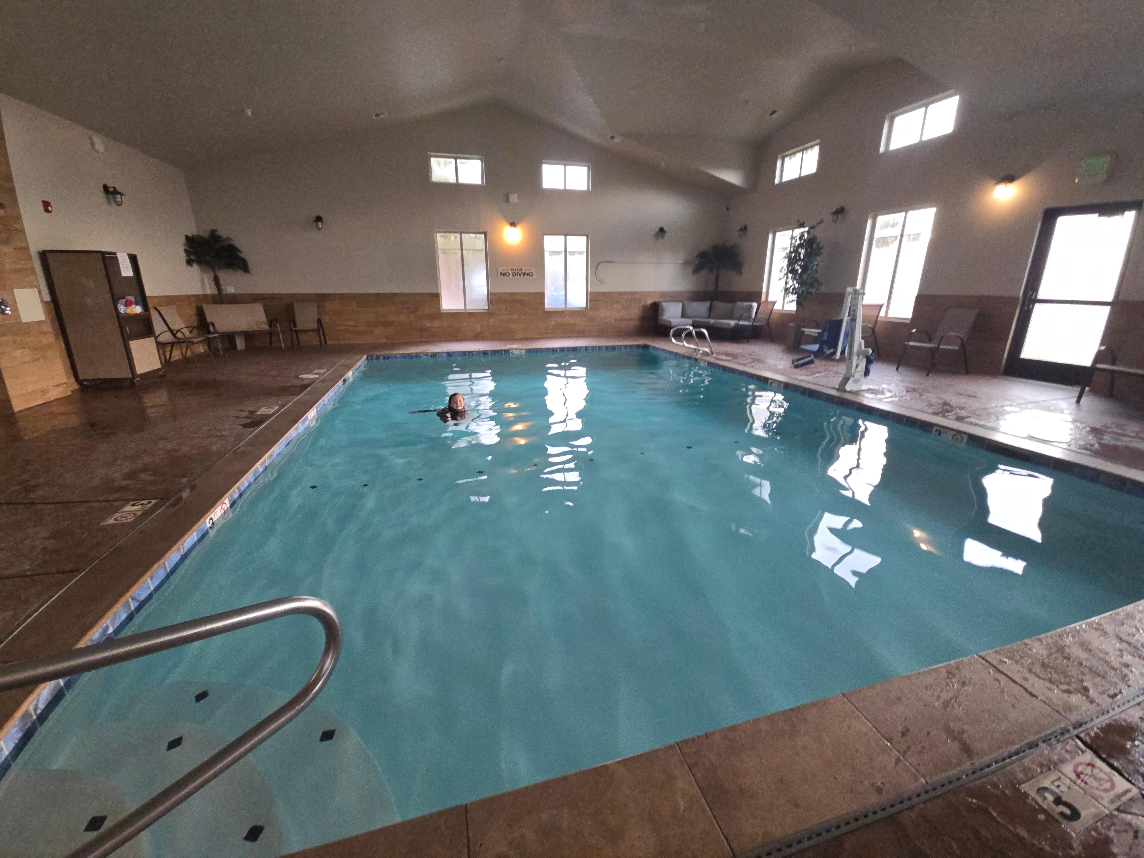 Great indoor pool with shower and towels right there.