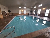 Great indoor pool with shower and towels right there.