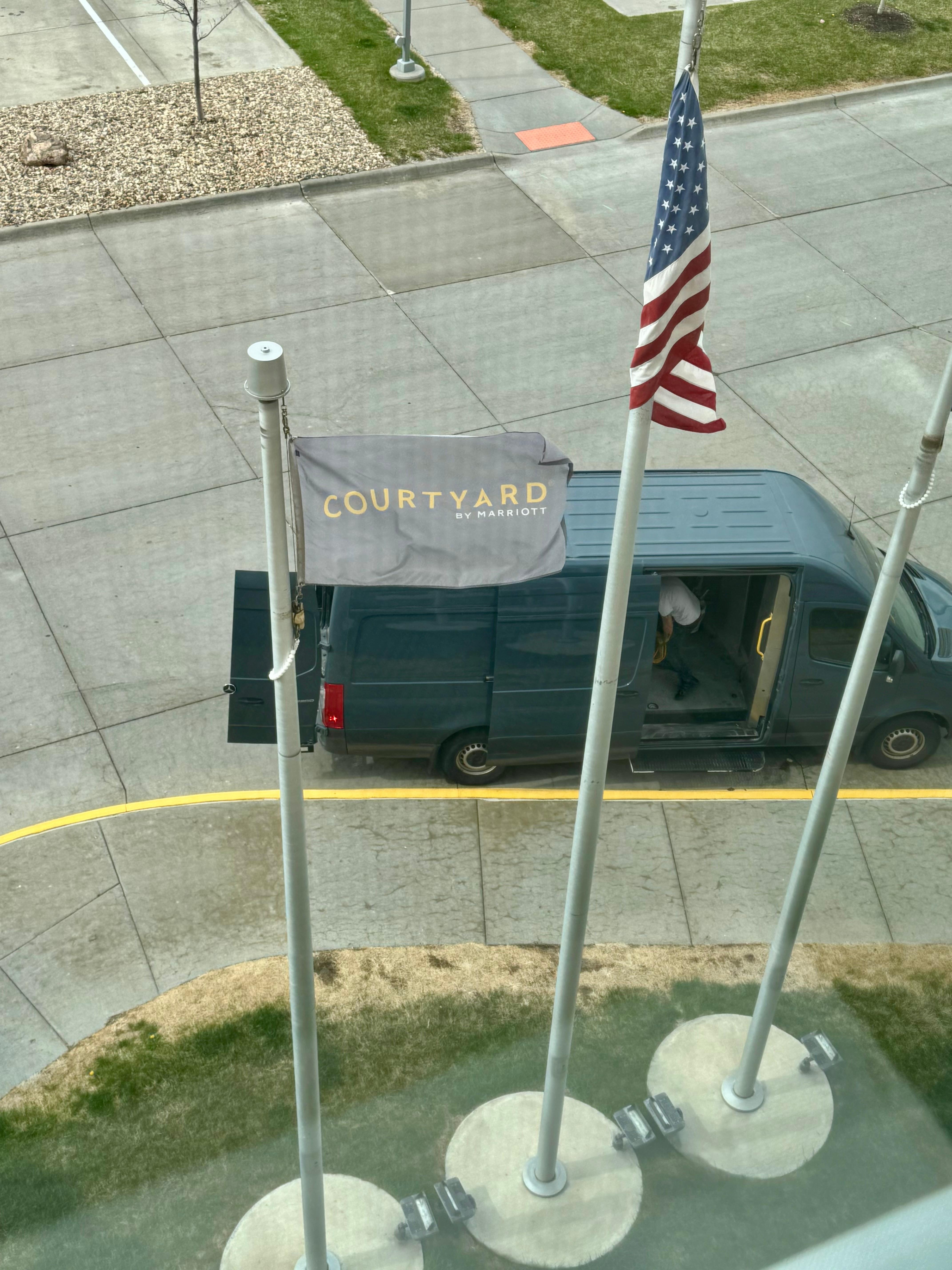 People were loading and unloading heavy equipment out of this van all day. There are also shipping crates that they were taking carpet out of in the background.