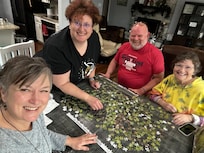 Family puzzle time at the table.