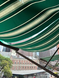 Torn canopy over small balcony