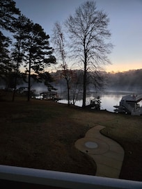 Rear yard with firepit & view to lake from deck