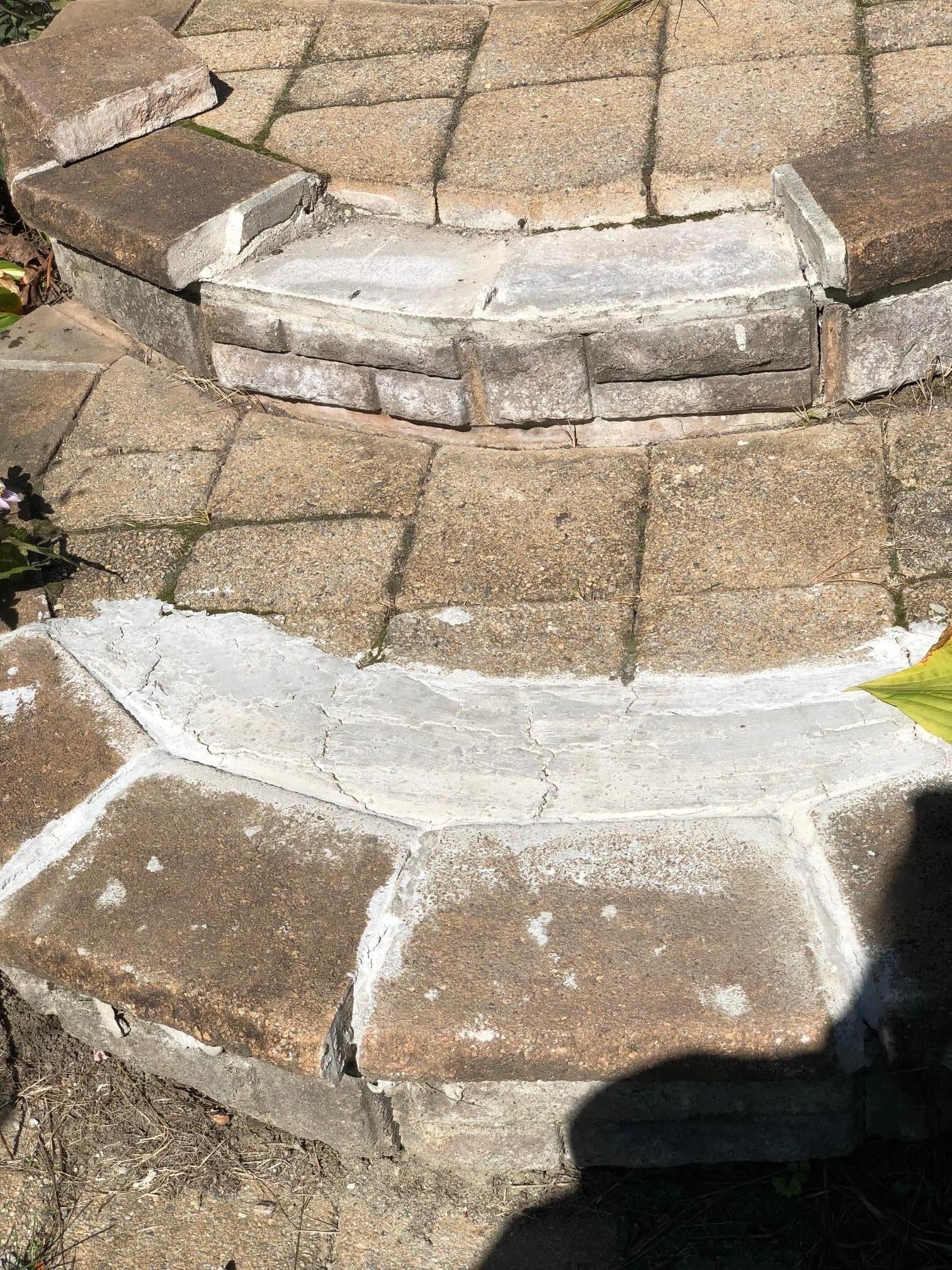 Broken front steps, tripping hazard