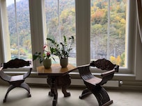 Cute table at the top of the stairs. Looking out on the back of the hotel, the river.