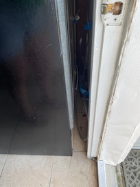 Food behind fridge