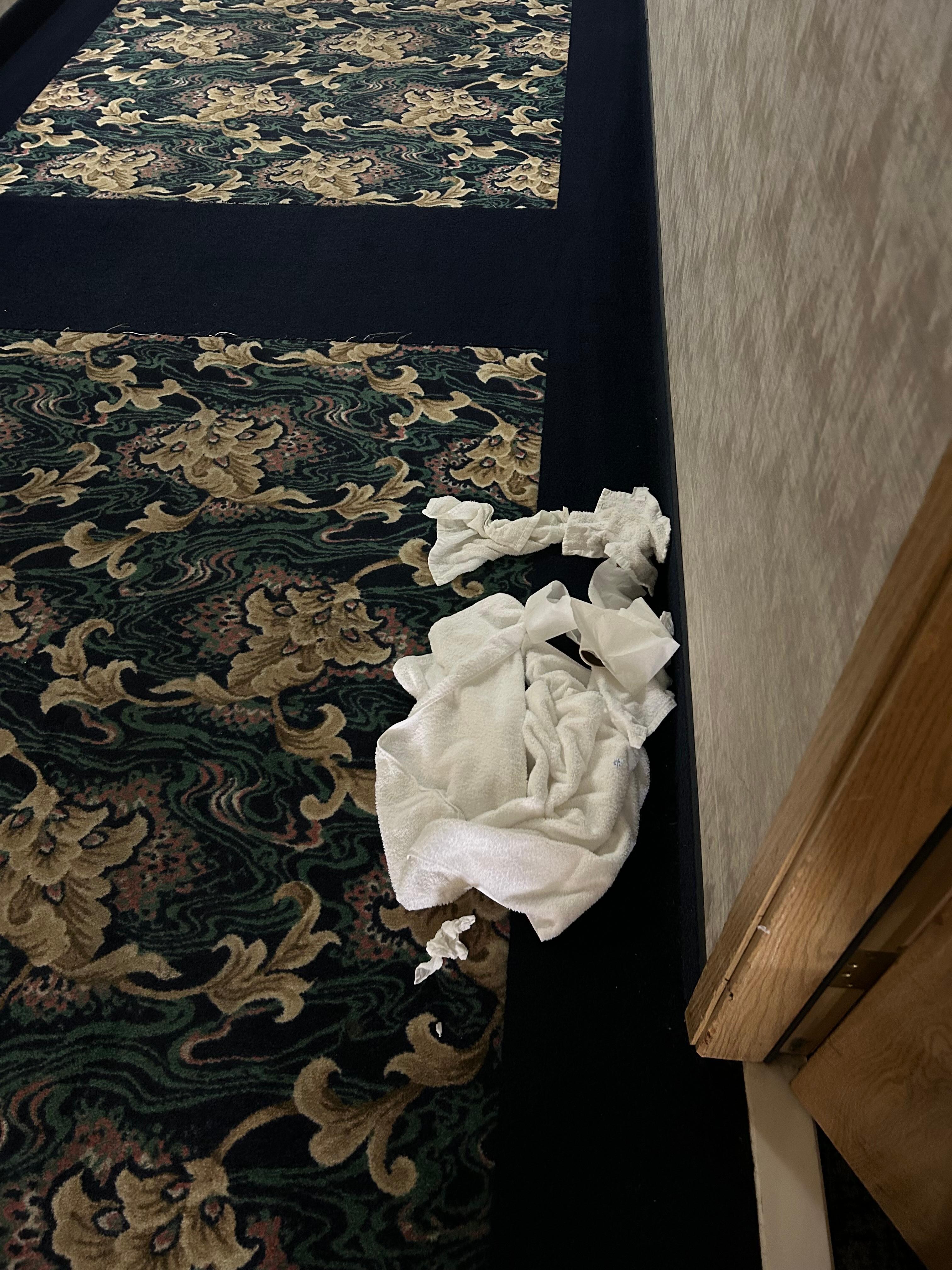 Trash and towels outside my room as I checked in and the following morning as I left. 