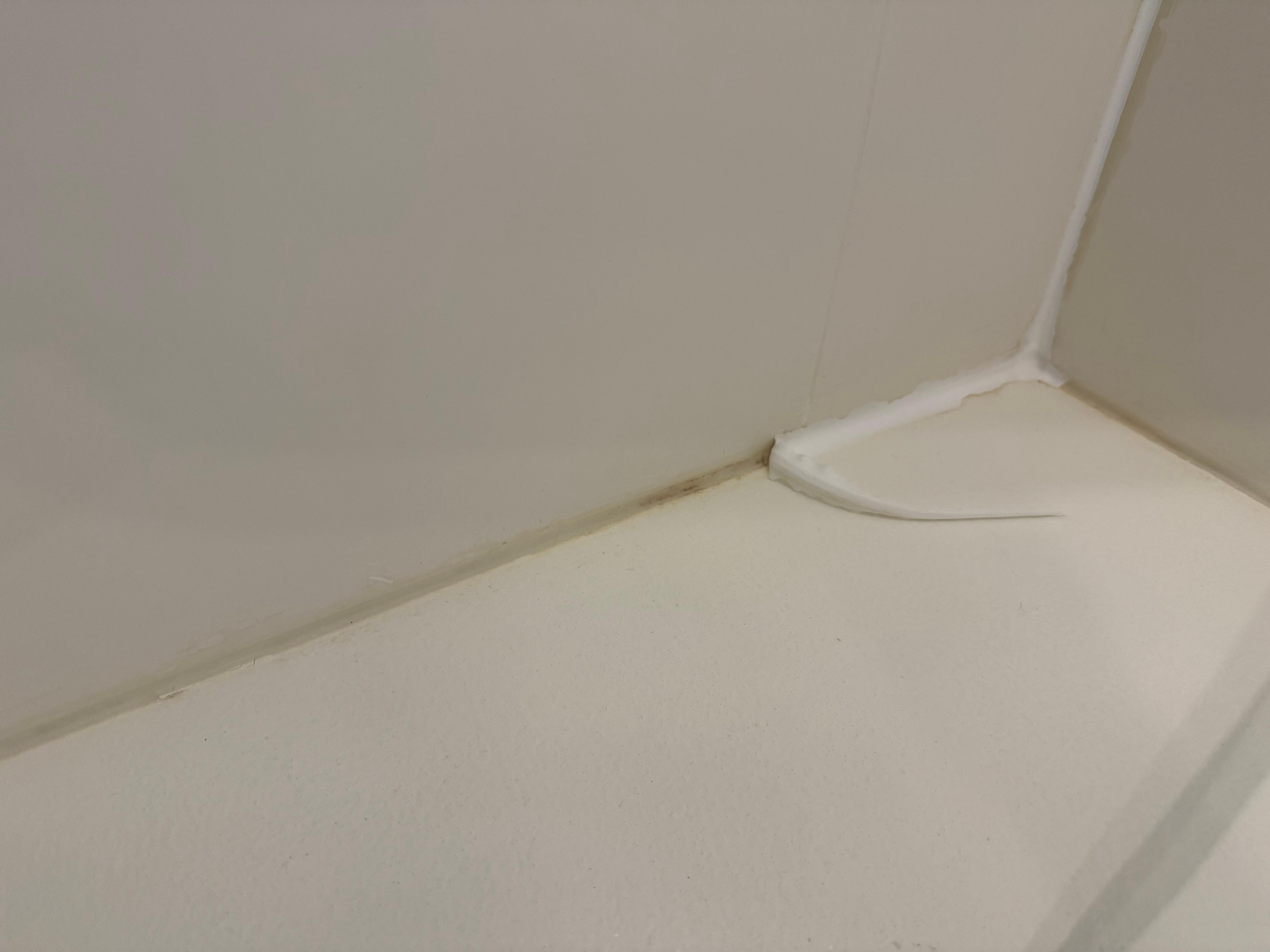 Peeling and completely absent caulk in shower