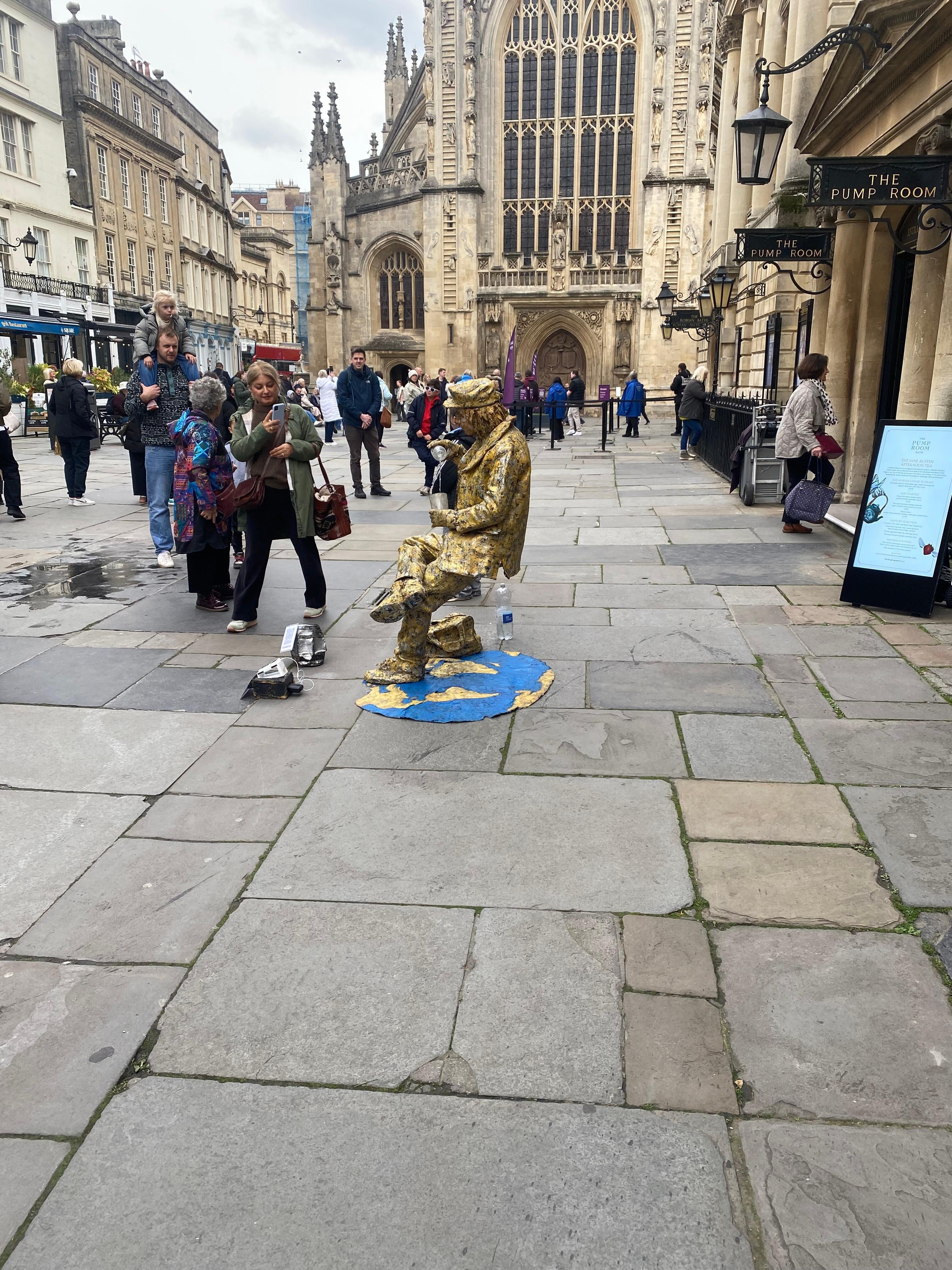 Wierd looking gold man performing in Bath