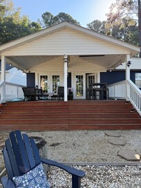 Covered porch with eating table, outdoor sofa and chairs