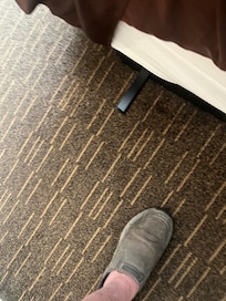 Bed fame was the wrong size for the mattress and it was covered by the dust ruffle and I struck my leg and cut my leg I told the front desk about it and they seemed not to care