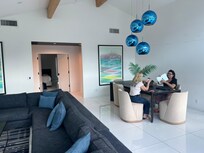 Dining table and sofa in the main room.