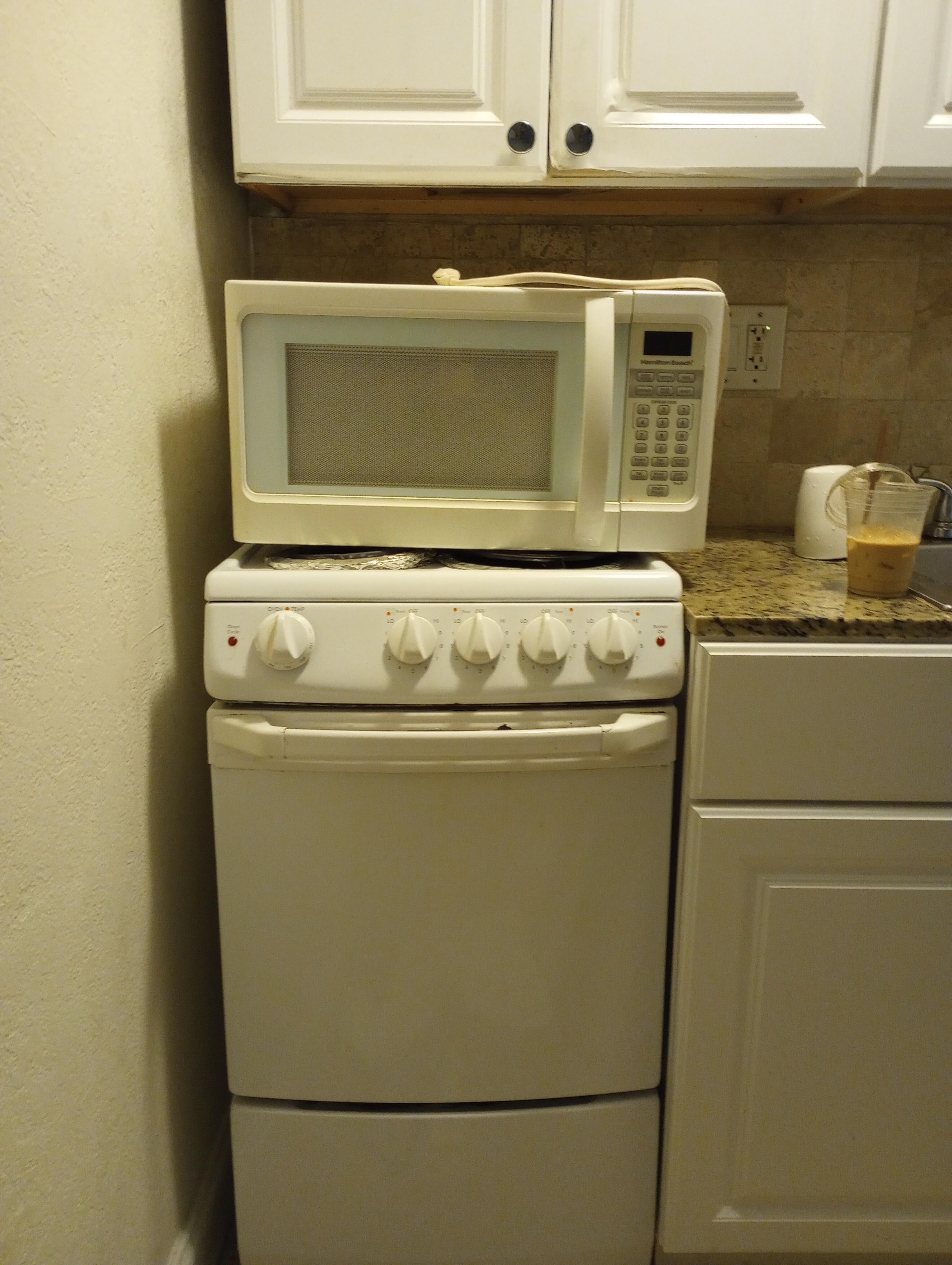 Microwave on top of stove. How to use stove, and countertop only?