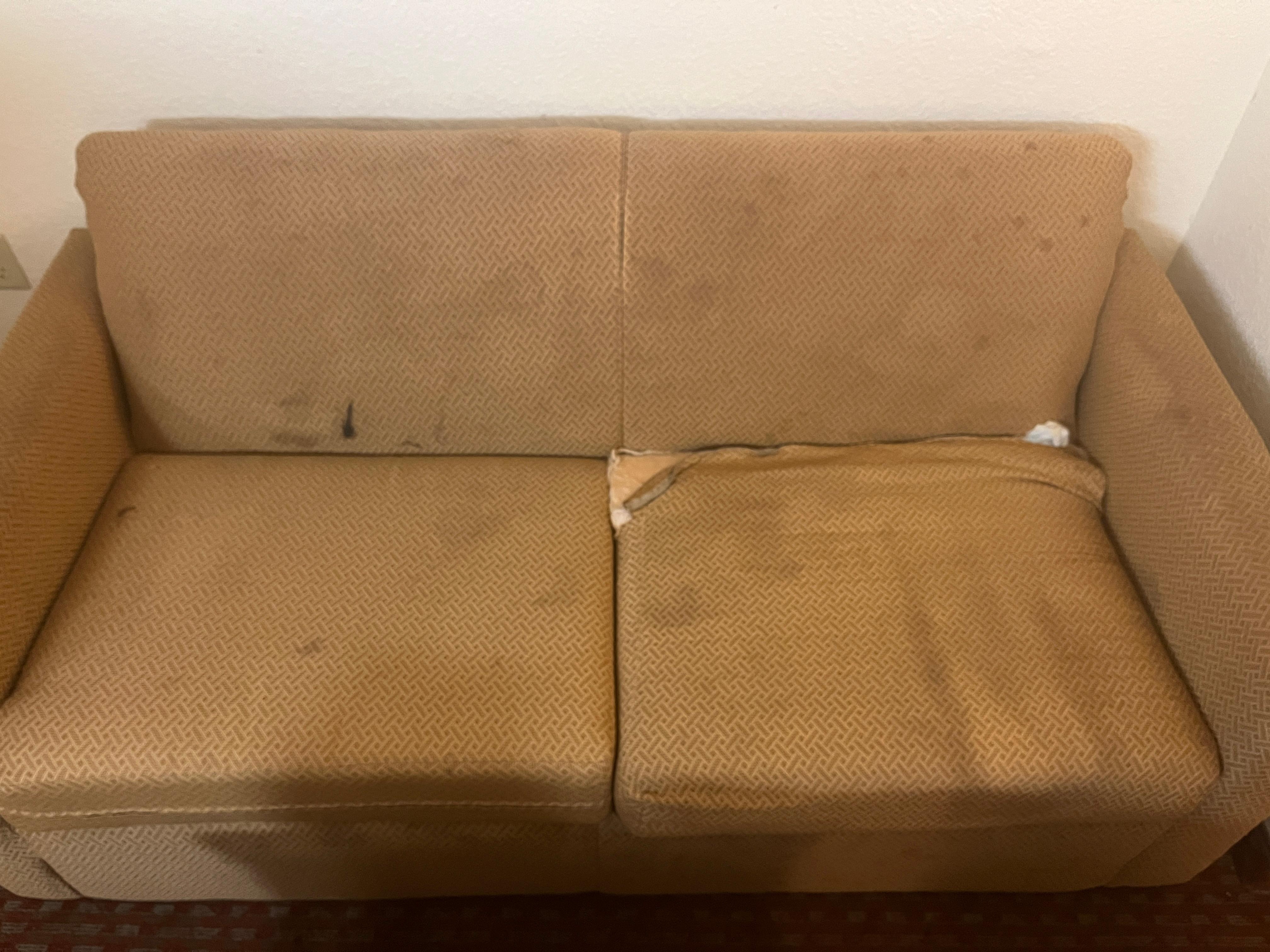 Couch in the room seemed it came from the street. 