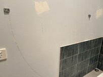 Towel rack that broke and by marks on wall had several times before
