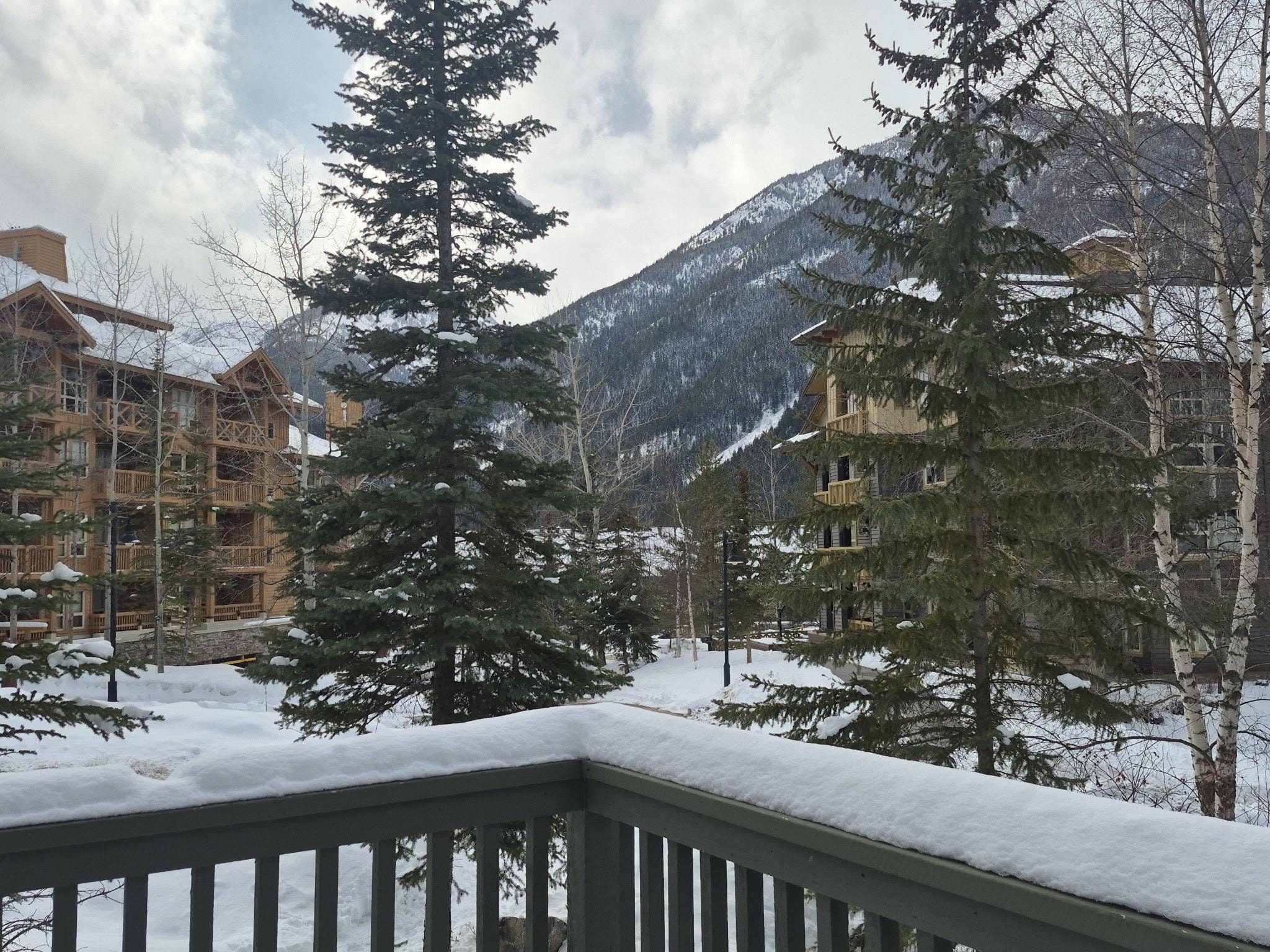 Deck has table and grill. Hot pool/tub across road past bldg on left. 