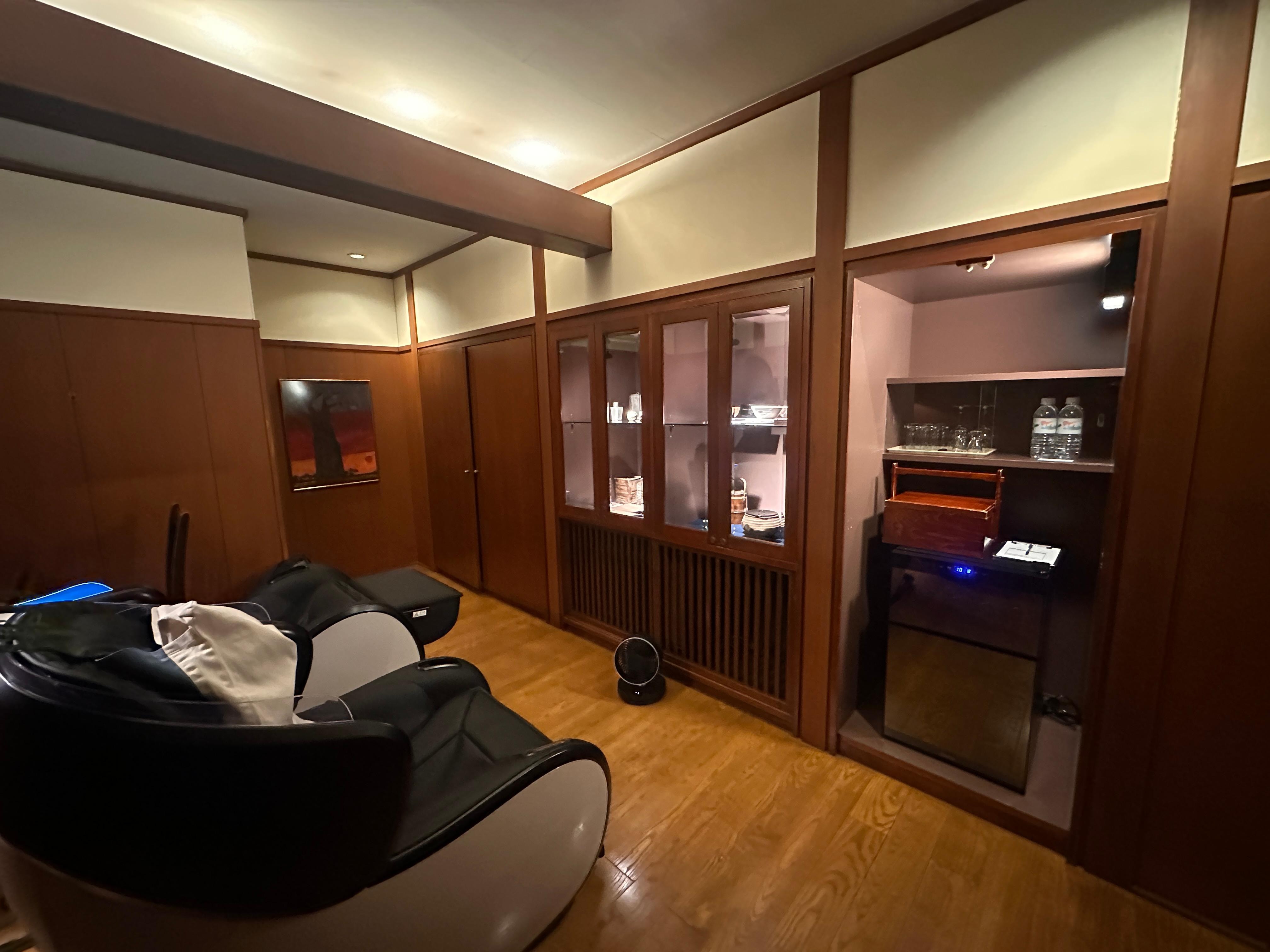 There are 2 massage chairs in the room.