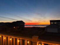 Love the night time deck vibe. Gas fireplace, deck lighting and comfy chairs!