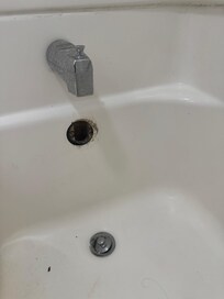 first room hair dirty tub and hole in the tub