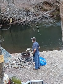 Firepit by Stream behind cabin