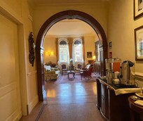 Hallway from reception desk. Includes complimentary drinks cookies & pastries